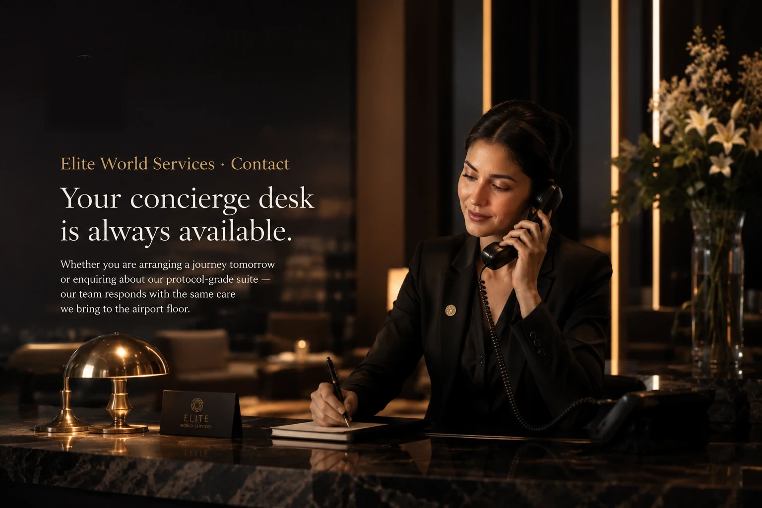 Elite World Services — concierge at desk